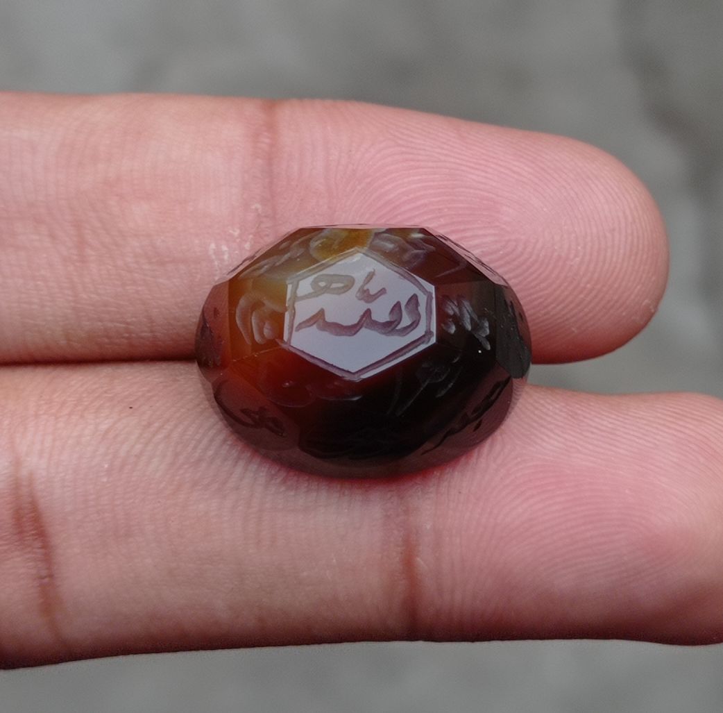 34.5ct Carnelian Carving - Engraved Aqeeq - 12 Imam Name - 22x17mm 34.5ct Carnelian Carving - Engraved Aqeeq - 12 Imam Name - 22x17mm