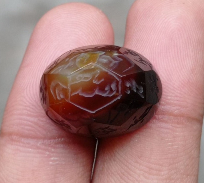 34.5ct Carnelian Carving - Engraved Aqeeq - 12 Imam Name - 22x17mm 34.5ct Carnelian Carving - Engraved Aqeeq - 12 Imam Name - 22x17mm